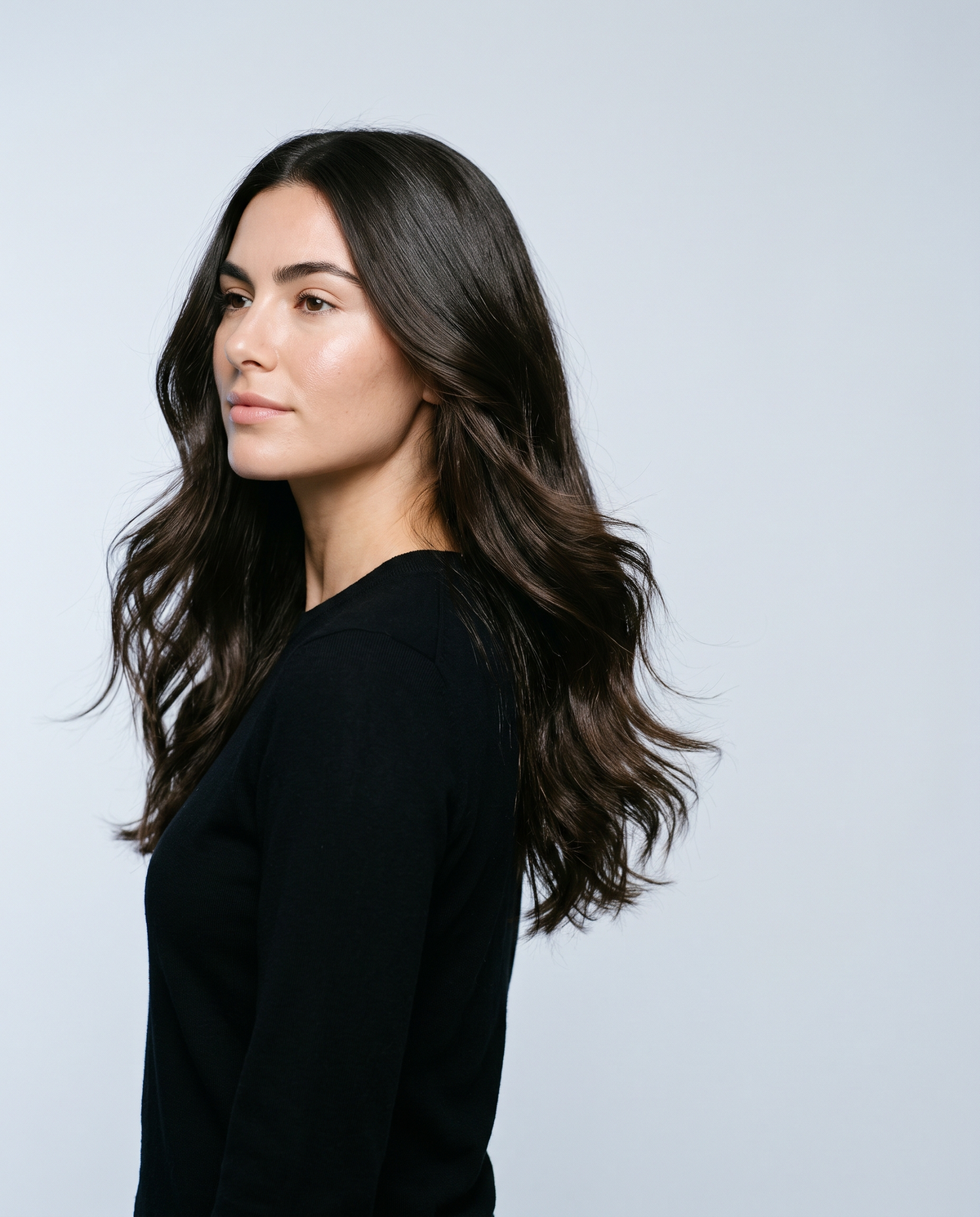 Woman with long glossy healthy brown hair